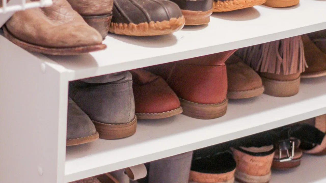 Close up on a plate of mashed potatoes, topped with baked pork chops with cream of mushroom soup, and a side of green beans.